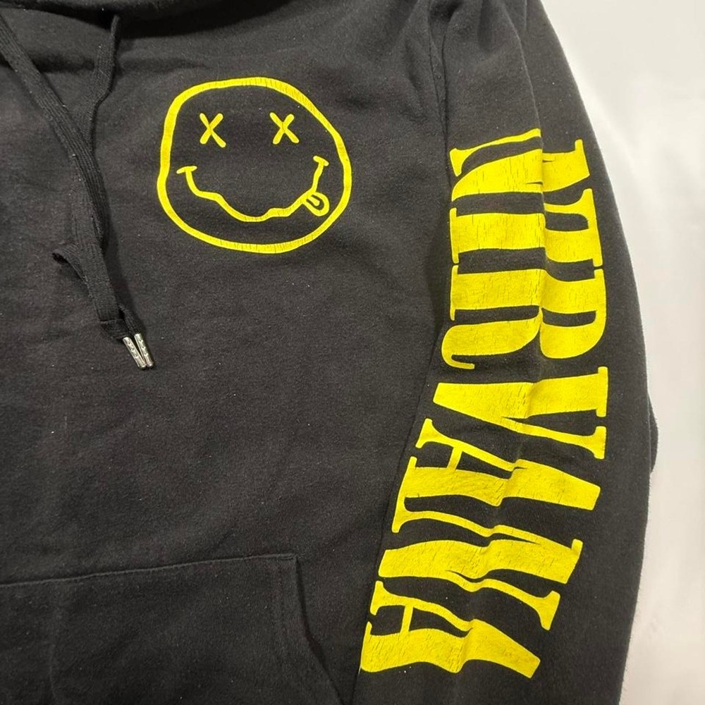 Nirvana black hoodie with yellow smiley face graphic and 'NIRVANA' text